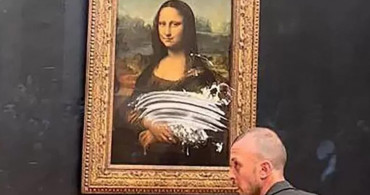 Leonardo da Vinci'nin başyapıt eseri Mona Lisa tablosuna kremalı pasta ile protesto!